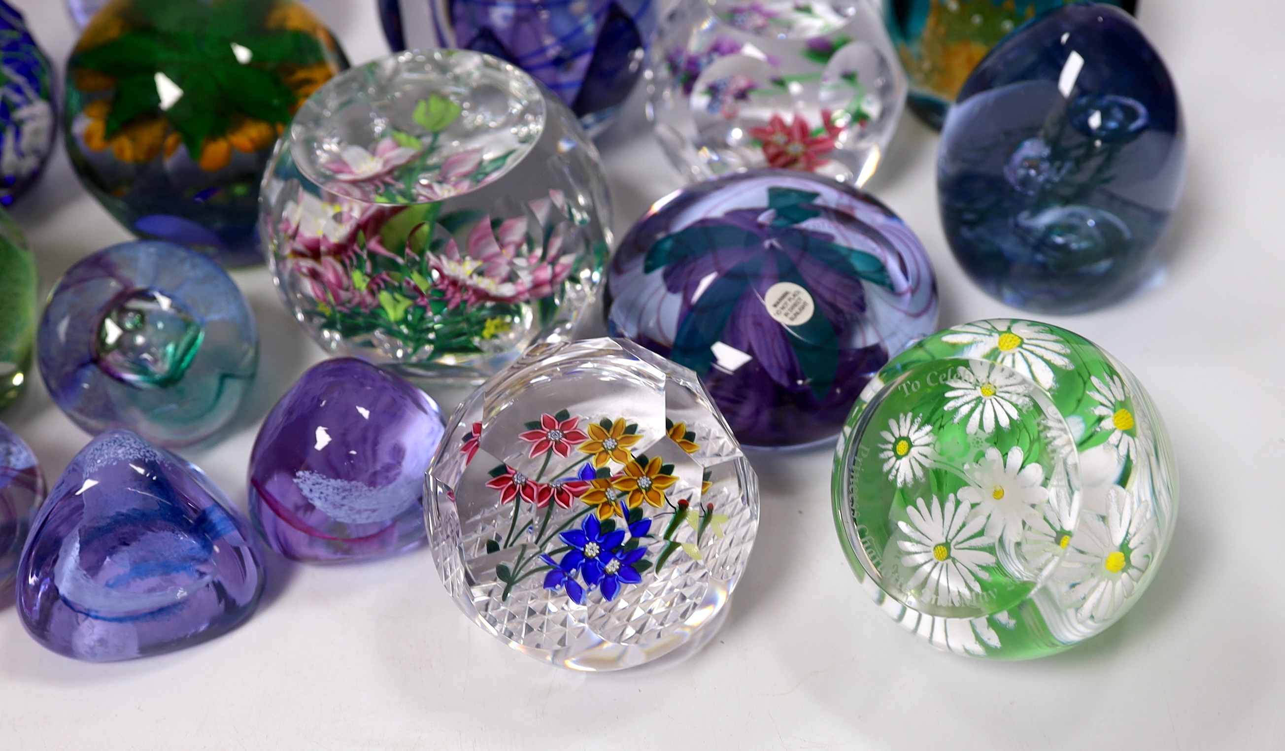 A collection of sixteen modern Caithness glass paperweights with boxes including some limited edition, largest 8cm high